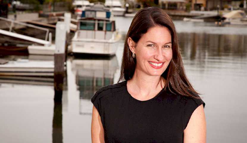 A photo of Lynette Manciameli at the docks in business attire.